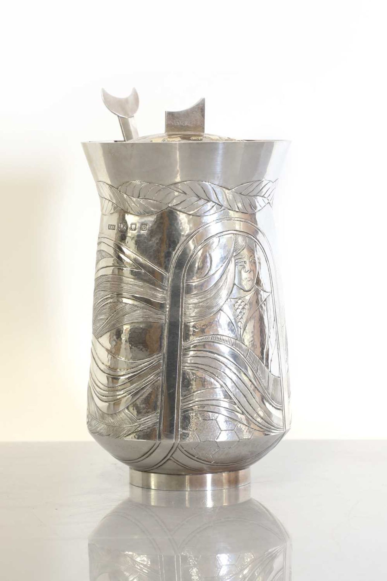 A silver honey pot, cover and spoon,