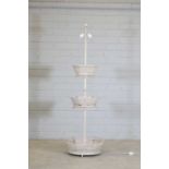 A painted three-tier basket standard lamp,