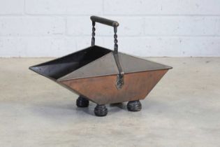 A copper-finished coal scuttle,