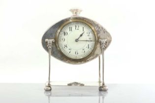 An Arts and Crafts silver-plated desk clock,