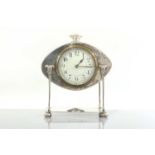 An Arts and Crafts silver-plated desk clock,