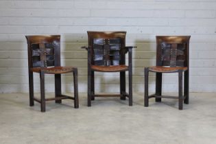 Three Glasgow School of Arts and Crafts oak and leather chairs,