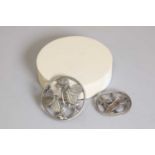 Two sterling silver brooches by Georg Jensen,