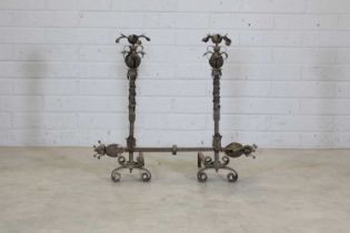 A pair of Italian wrought-iron firedogs and bar,