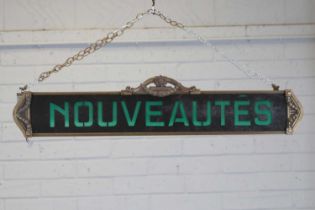 A French Art Nouveau 'Nouveautés' sign,