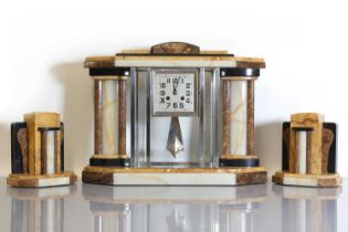 An Art Deco marble and onyx clock garniture,