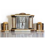 An Art Deco marble and onyx clock garniture,