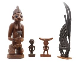 A group of four African wood carvings