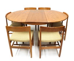 An extending teak dining table