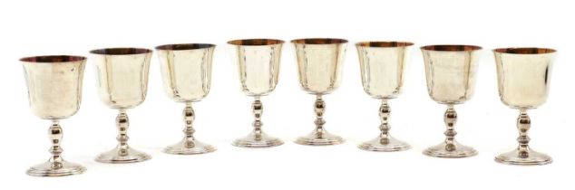 A set of eight silver and silver-gilt goblets