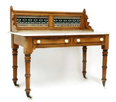 An Arts & Crafts pine, marble topped and tiled back washstand