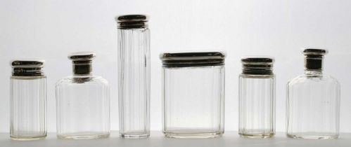 Six silver mounted dressing table bottles,