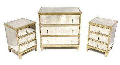 A mirrored chest of three drawers,