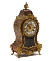 A faux tortoiseshell and gilt-metal Boulle mantel clock