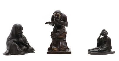 A group of three bronze figures,