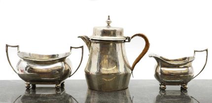 A silver hot water pot