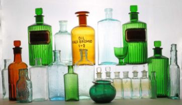 A group of glass apothecary bottles,