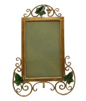 A brass and enamelled photograph frame