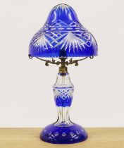 A Bohemian blue flashed cut glass table lamp,