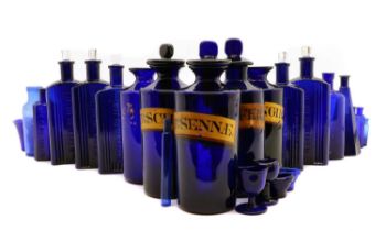A collection of blue glass apothecary jars,