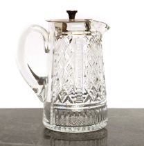 A cut glass and silver-mounted water jug