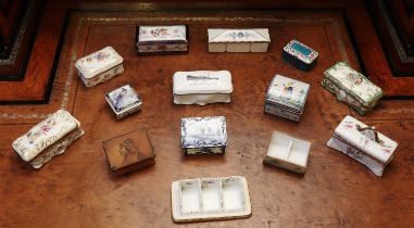A collection of porcelain stamp boxes