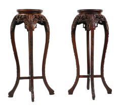 A pair of hardwood jardiniere stands,