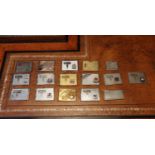 A group of chromed bi-fold stamp cases