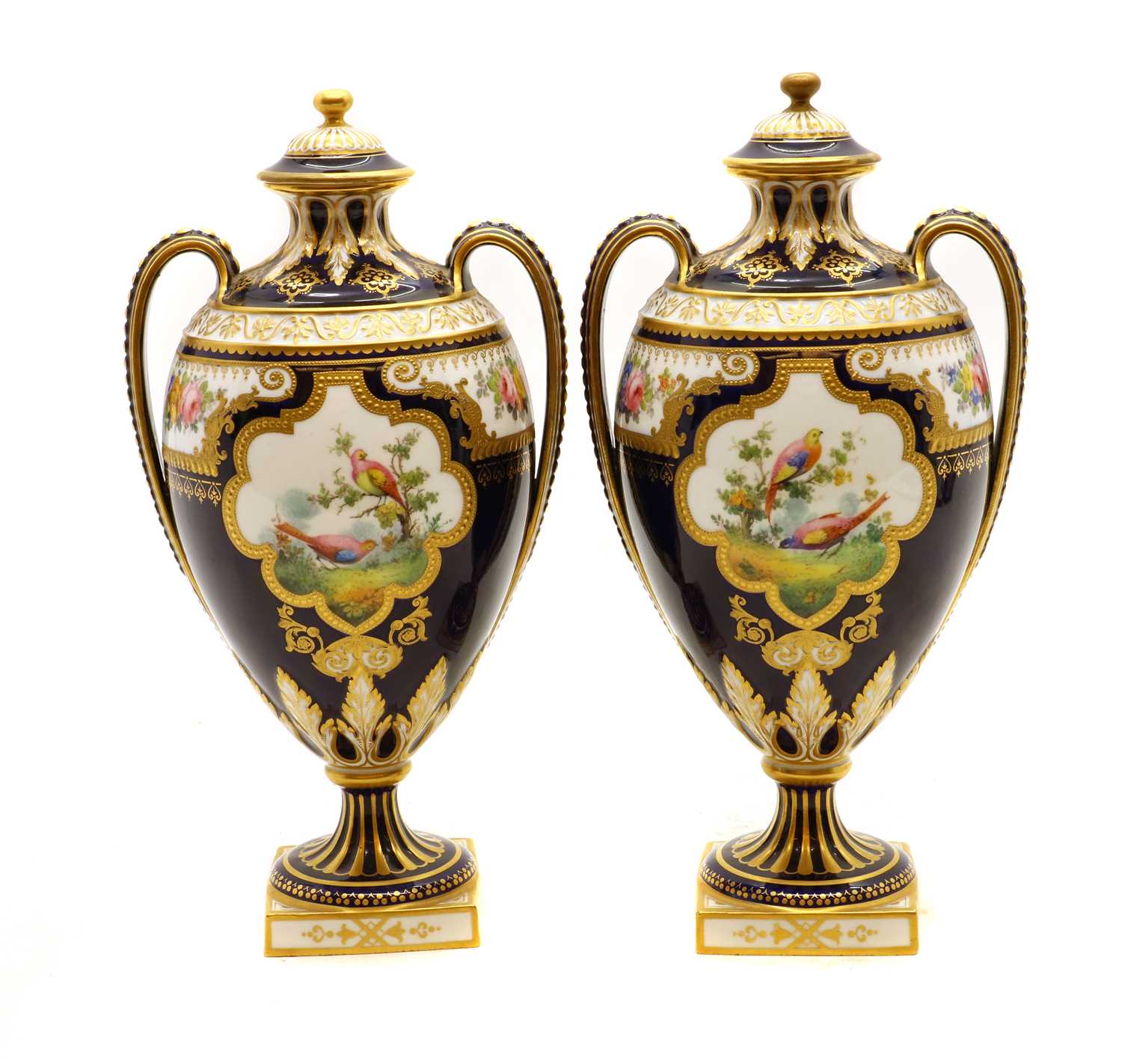 A pair of Royal Crown Derby twin handled vase and covers