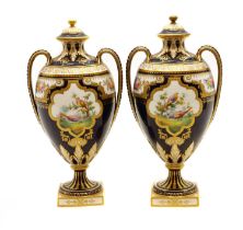 A pair of Royal Crown Derby twin handled vase and covers