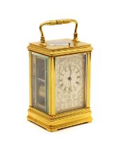 A lacquered brass carriage clock