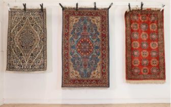 Three Persian Kashan rugs,