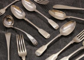 A collection of silver flatware