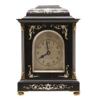 An ebonised and ivory inlaid French style mantel clock,