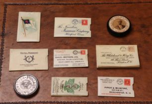 A group of advertising stamp boxes and books,