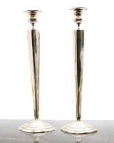 A pair of Chinese silver plated candlesticks
