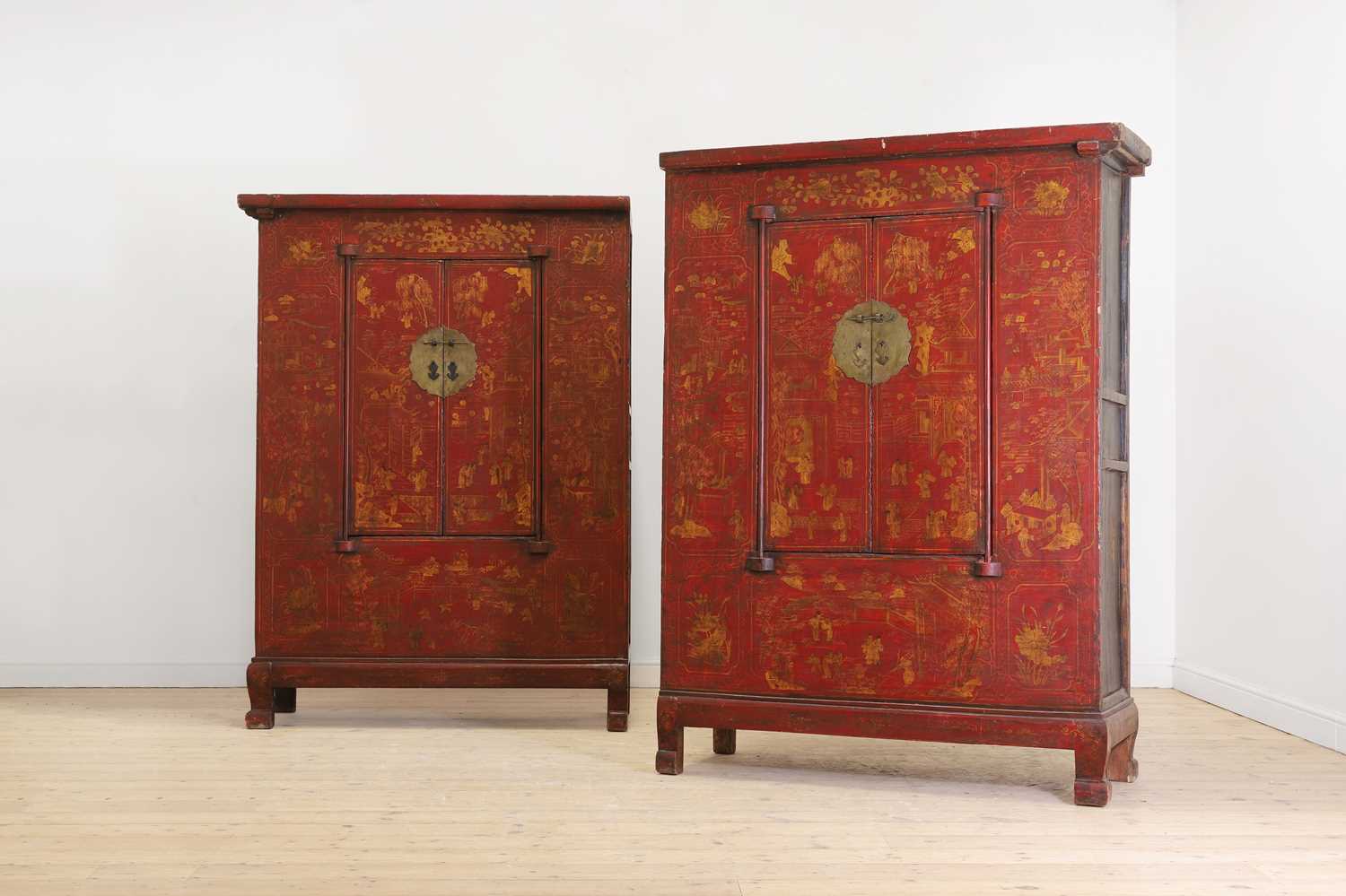 A pair of red-lacquered cabinets,