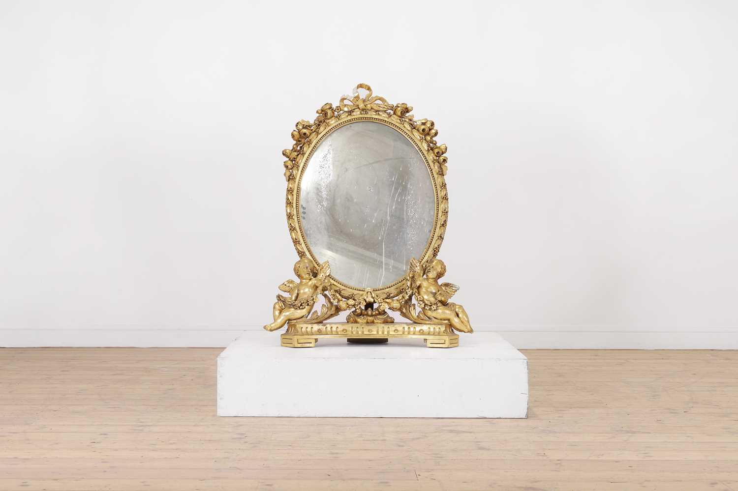 A Louis XV-style giltwood mirror,