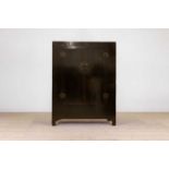 A black-lacquered marriage cabinet,