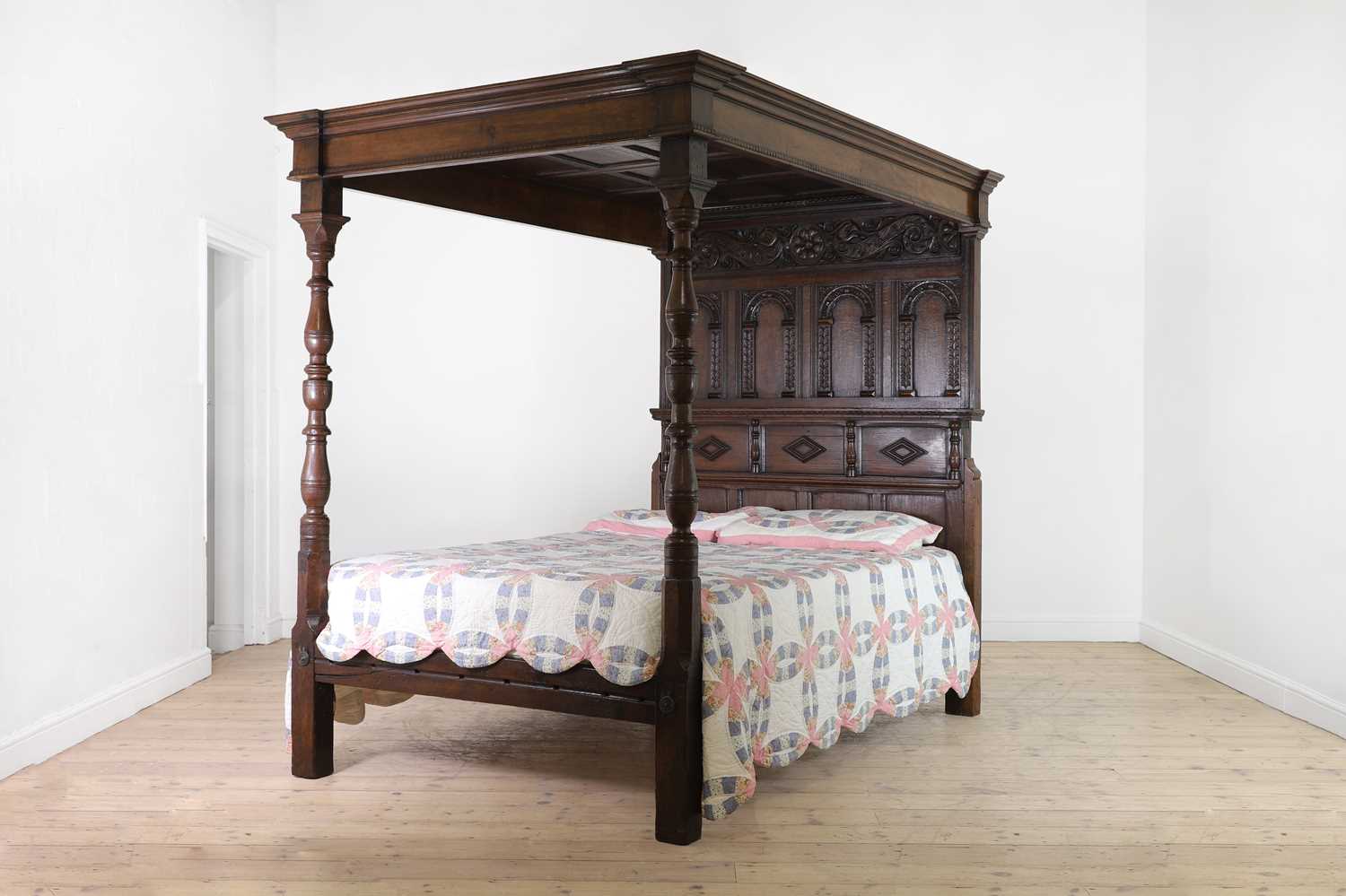 A carved oak three-quarter tester bed,
