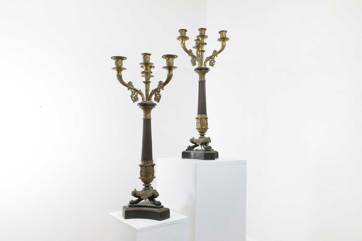 A pair of Empire-style bronze and parcel-gilt candelabra,