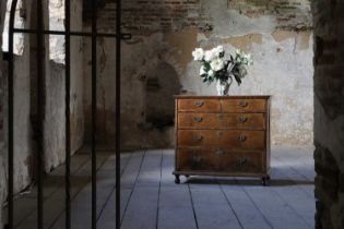 A George I walnut chest of drawers,