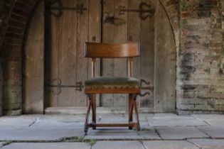 A Victorian oak chair designed by E W Pugin,