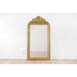 A Louis XVI-style giltwood and gesso wall mirror,