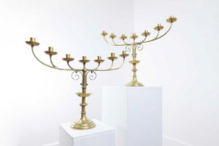 A pair of Victorian brass seven-branch candelabra,