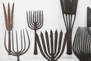 A collection of wrought-iron eel spearheads,