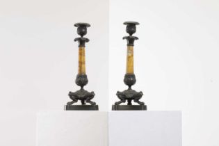 A pair of Empire bronze and Siena marble candlesticks,