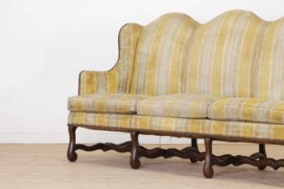 A pair of Louis XV walnut sofas,