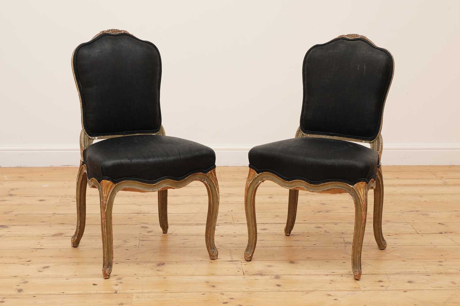 A pair of painted and parcel-gilt side chairs,