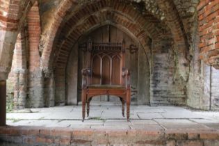 A Victorian Gothic Revival oak armchair,